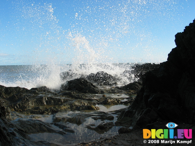 24242 Spray of waves splashing on rocks